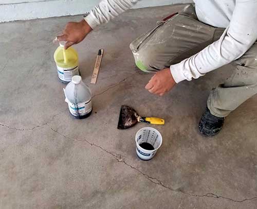 Concrete crack repair before floor coating